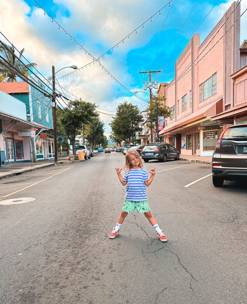 Kid standing in the middle of Market Street in Wailuku, Maui.