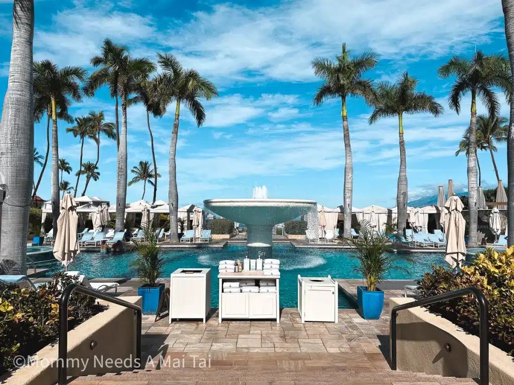 A view of the main pool with towels stacked at the Four Seasons Resort in Wailea, Maui, Hawaii. 