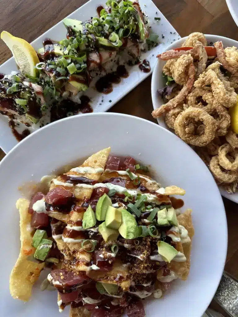 A variety of poke nachos, calamari, and salmon bombs from Restaurant 604, located on the water in Pearl Harbor, Oahu. 