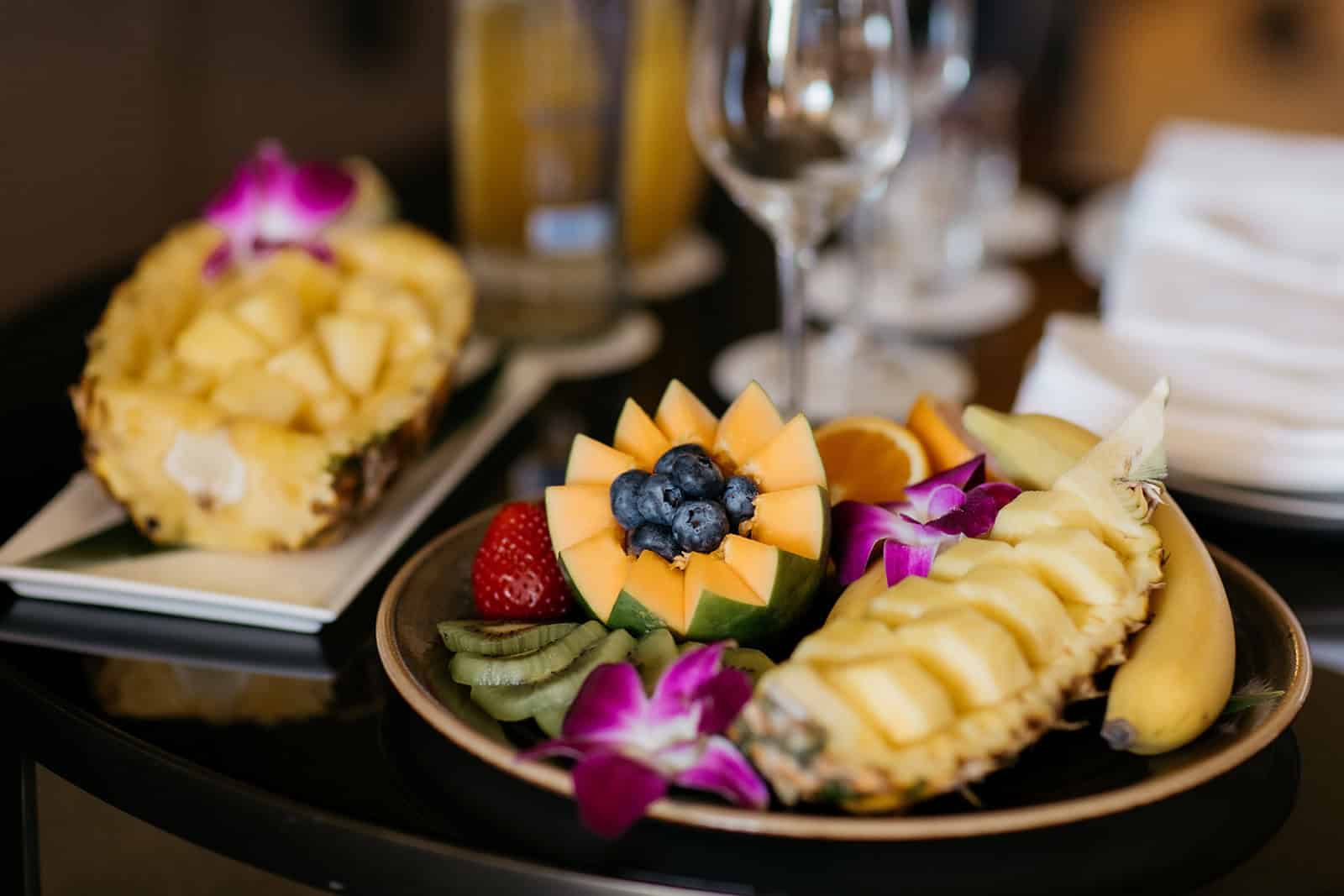 Tropical fruit platter with pineapple, mango, and berries served at a Hawaii resort breakfast